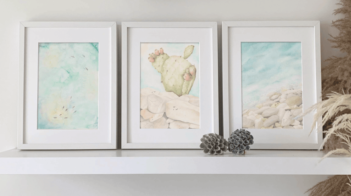 Querin Creations three framed artworks from the Echoes of the Sea Collection on a white shelf.