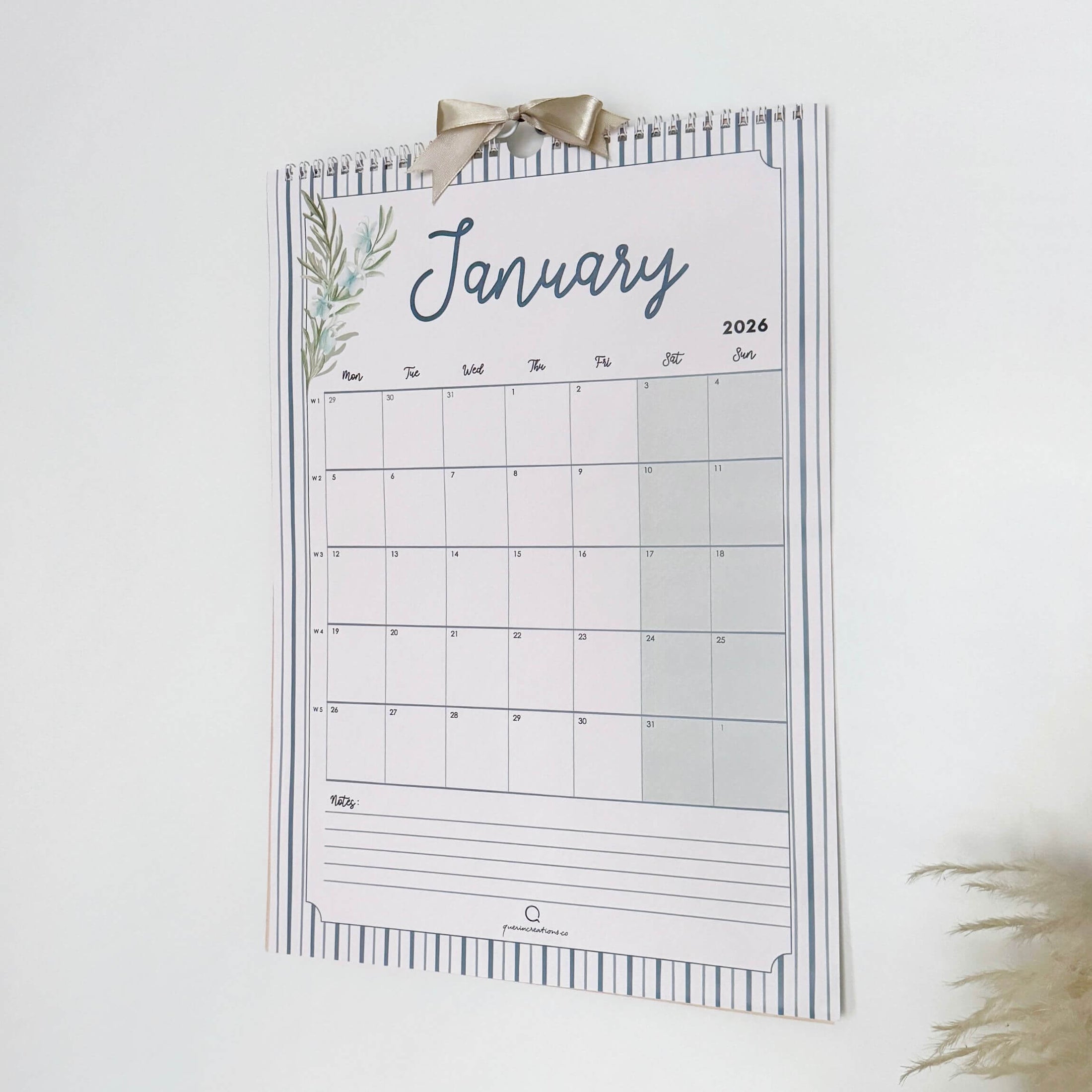 Wall calendar for January 2027 with decorative elements on a white background