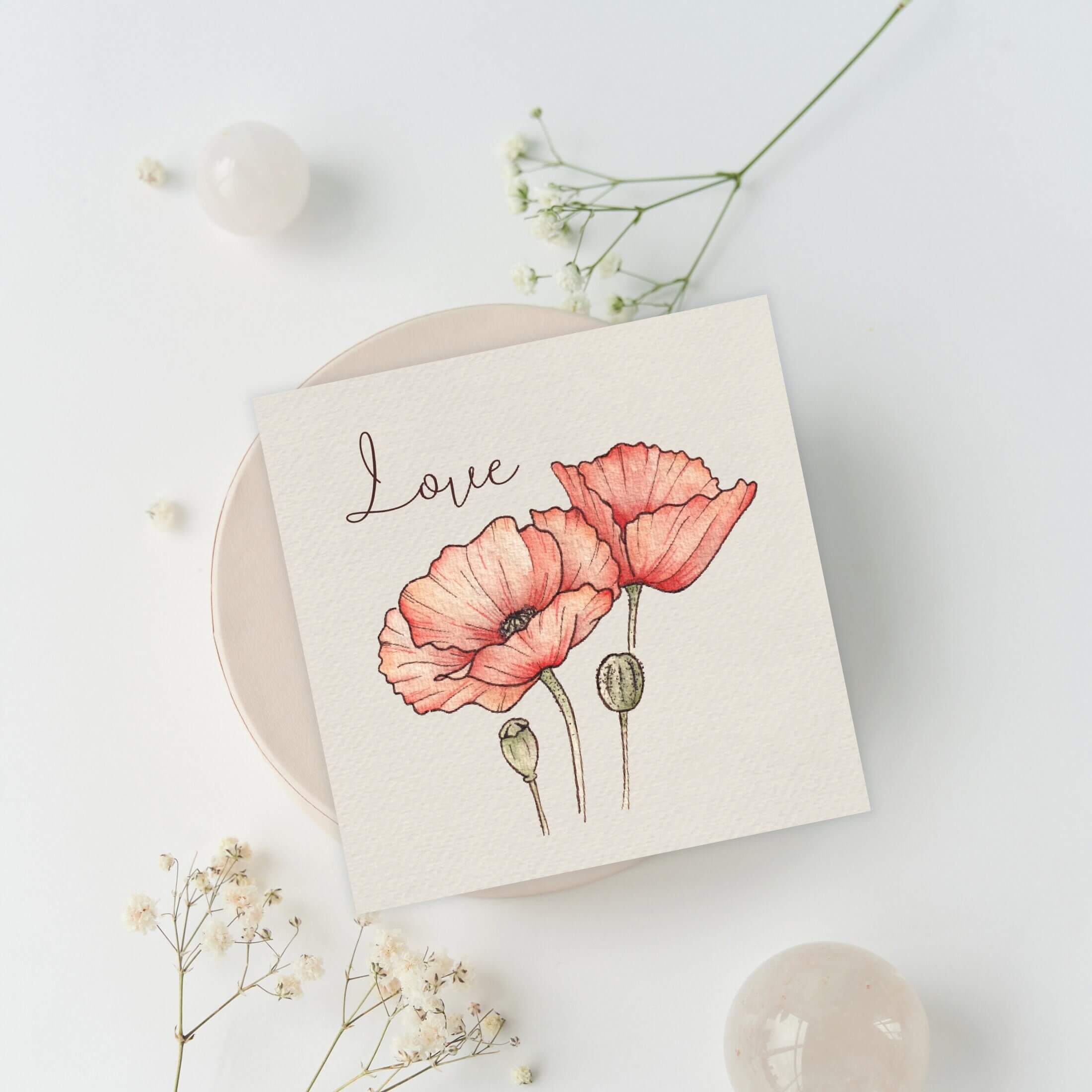 Querin Creations greeting Card with pink poppies and 'Love' text on a light background
