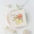 Load image into Gallery viewer, Querin Creations square greeting card with a cactus and flower illustration and the word 'Love' on a light background.
