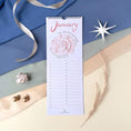 Load image into Gallery viewer, Querin Creations Perpetual calendar on a decorative background with ribbons and starfish
