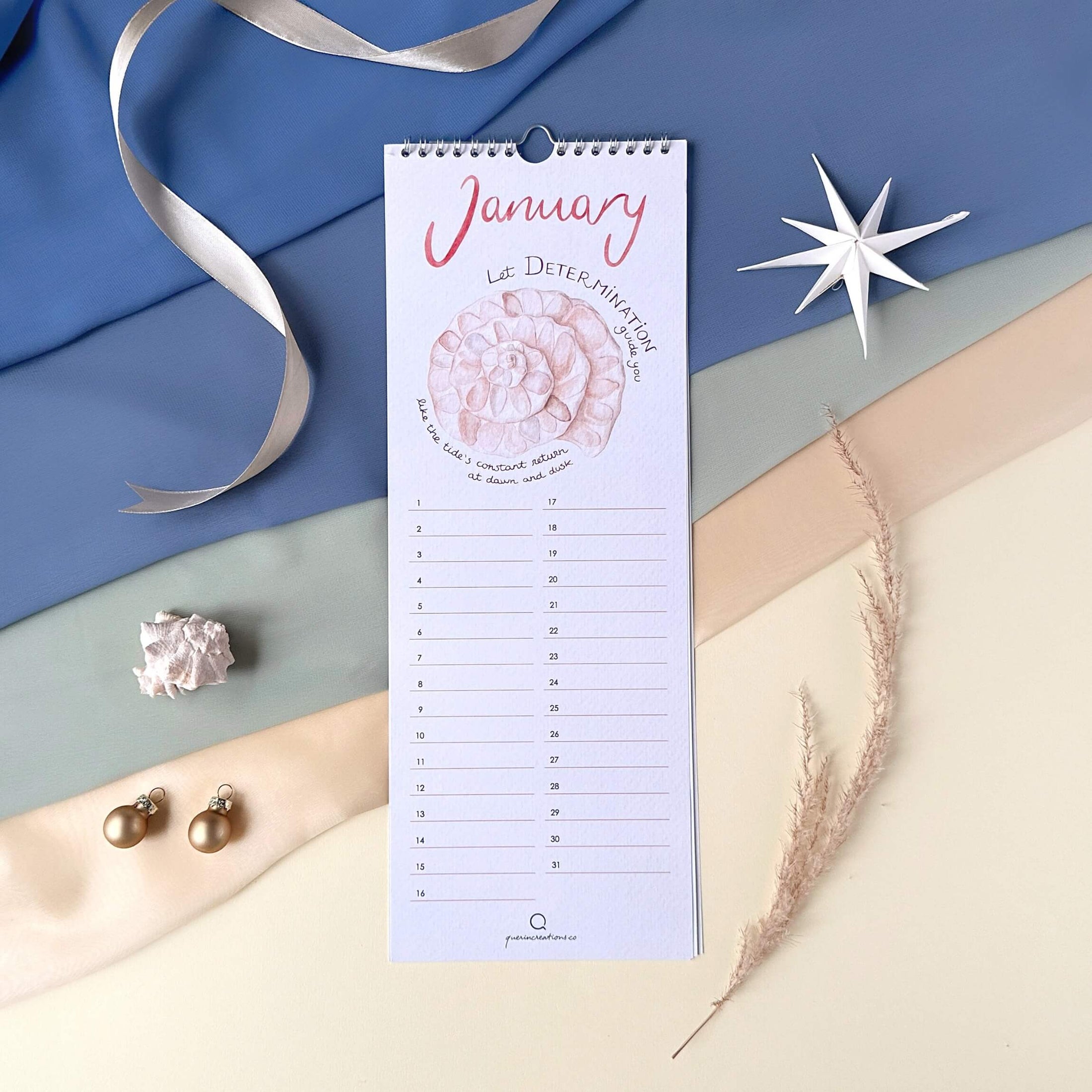 Querin Creations Perpetual calendar on a decorative background with ribbons and starfish