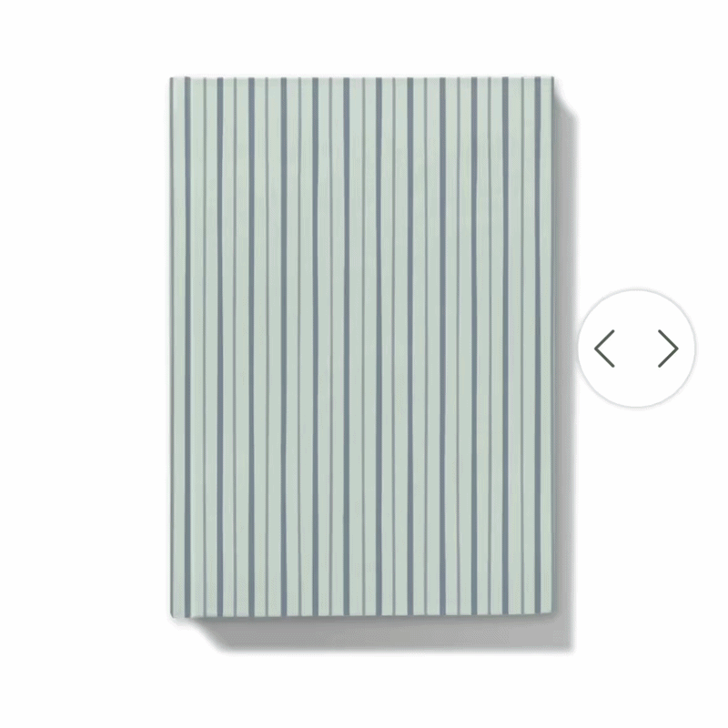 Gif showing how the journal looks with personalised floral monogram on notebook with blue shades striped cover on a white background