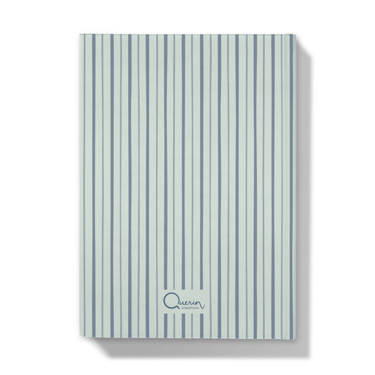 Back of a notebook with blue shades striped cover on a white background