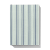 Notebook with blue striped cover on a white background