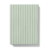 Notebook with deep green and mint green  striped pattern on a white background