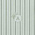 Load image into Gallery viewer, Detail of personalised floral monogram with oleander flower on notebook with green shades striped cover 
