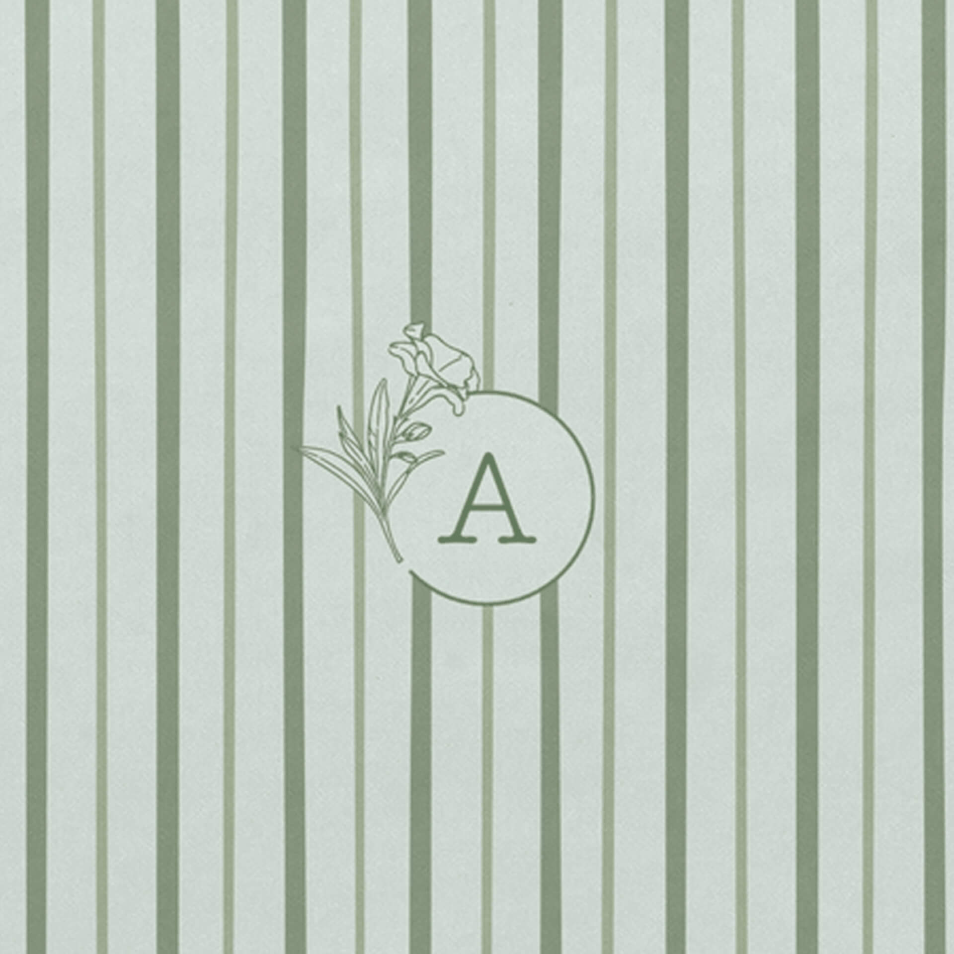 Detail of personalised floral monogram with oleander flower on notebook with green shades striped cover 