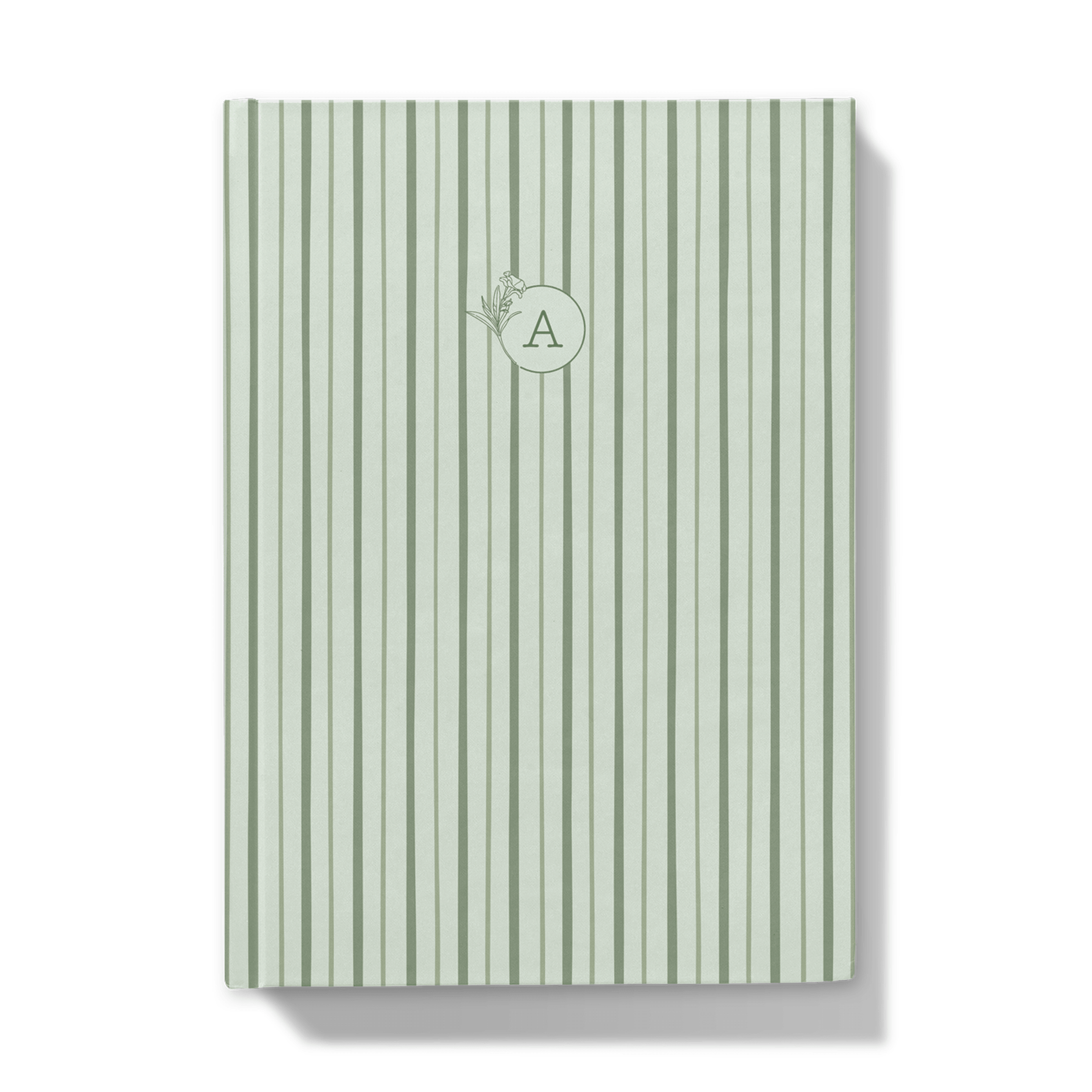 Green striped notebook with a floral monogram on a white background
