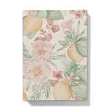 Front of notebook with lemons and mediterranean flowers pattern on a blush pick background