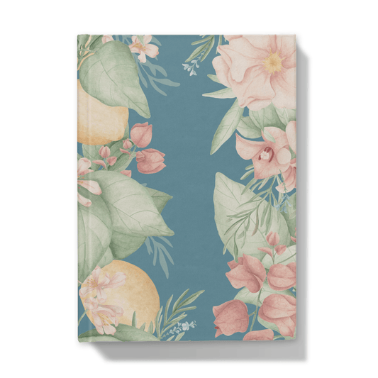 Front of notebook with floral and citrus design on a blue background