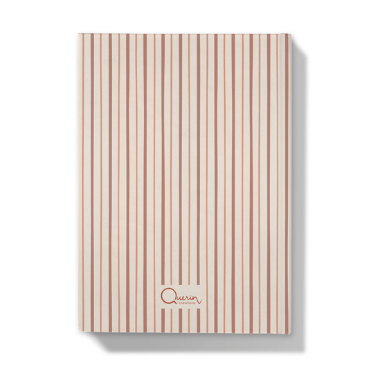 Back of a striped notebook on red and pick shades on a white background
