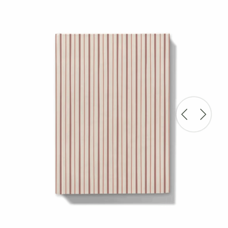 Gif showing how the journal can be personalised with a floral monogram on notebook with red and pink shades striped cover 
