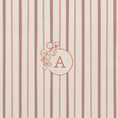 Load image into Gallery viewer, Detail of personalised floral monogram with bougainvillaea wreath on notebook with red and pink shades striped cover 
