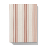 Notebook with a red and dust pink striped pattern on a white background