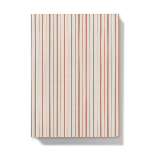 Notebook with a red and dust pink striped pattern on a white background
