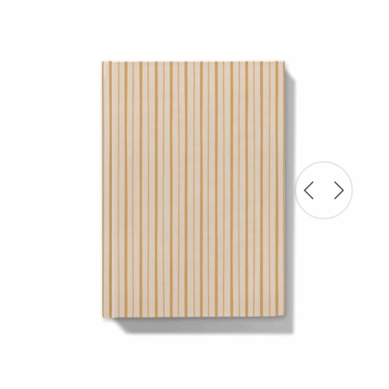 Gif showing how the journal can be personalised with a floral monogram on notebook with yellow shades striped cover 