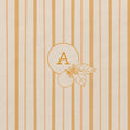 Load image into Gallery viewer, Detail of floral monogram with lemon flowers and leaves on notebook with yellow shades striped cover 
