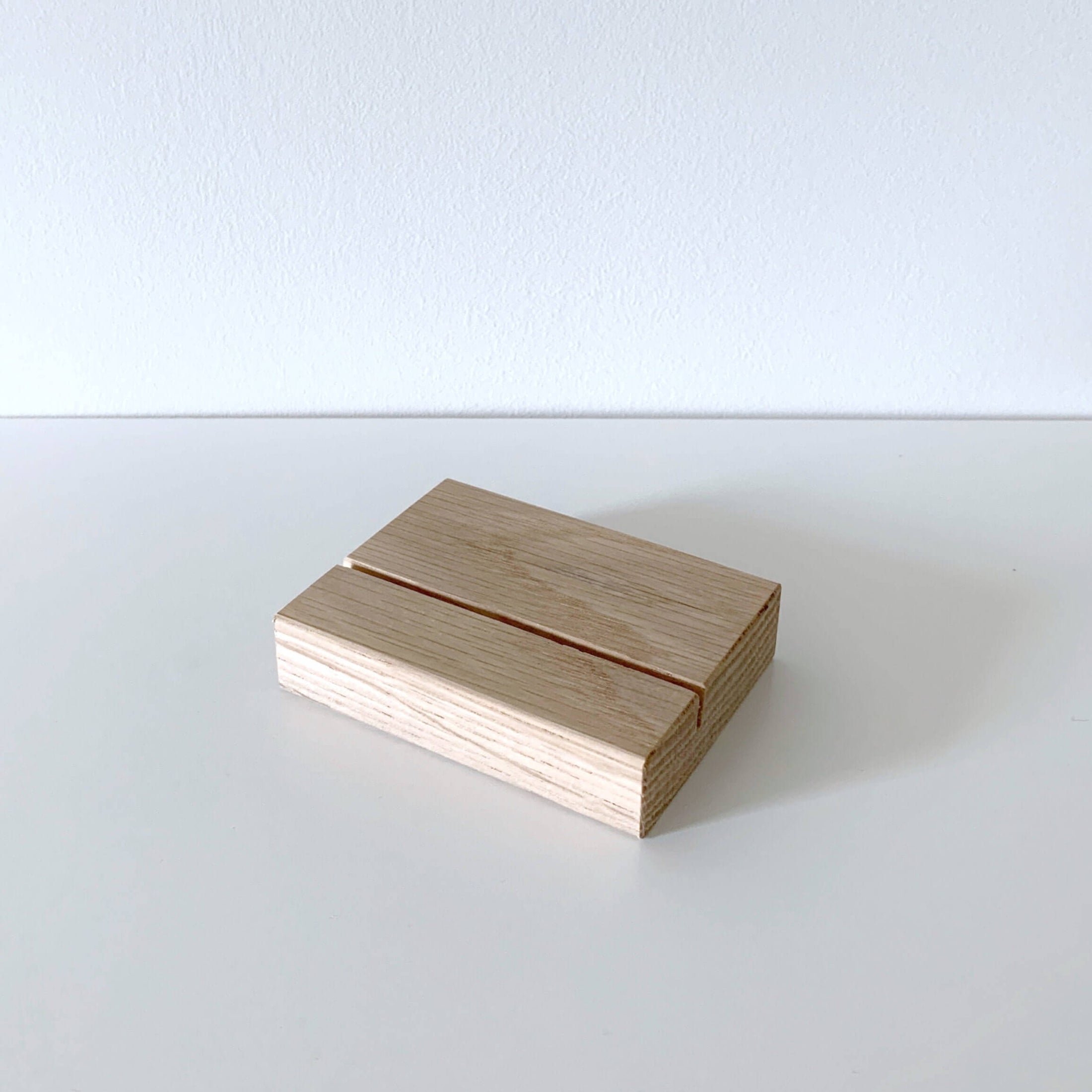 Wooden picture stand to hold calendar on a shelf 