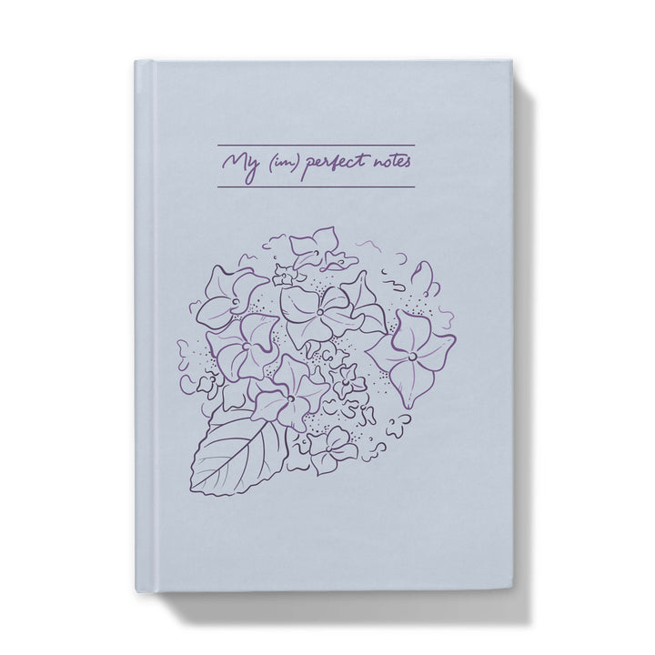 Notebook with floral design and text on a white background