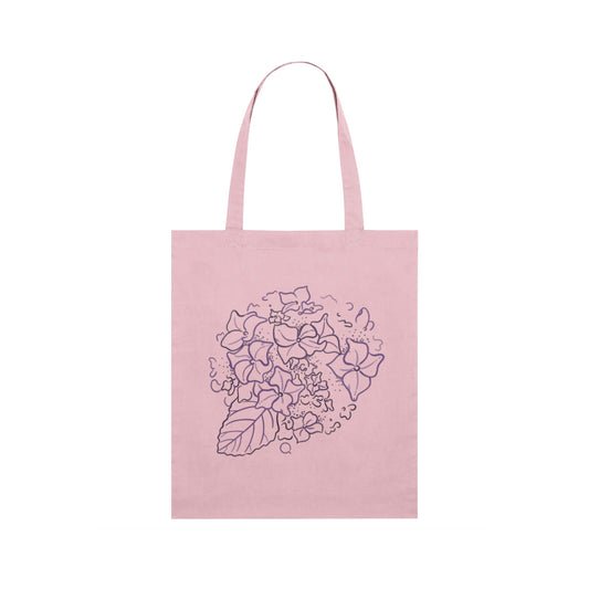 Pink tote bag with floral design on a white background, hydrangea design